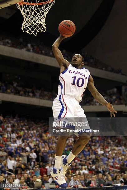 Tyshawn Taylor of the Kansas Jayhawks dunks against the Virginia Commonwealth Rams during the southwest regional final of the 2011 NCAA men's...