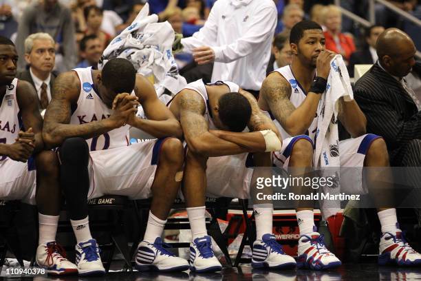 Thomas Robinson, Markieff Morris and Marcus Morris of the Kansas Jayhawks react afterduring the southwest regional final of the 2011 NCAA men's...