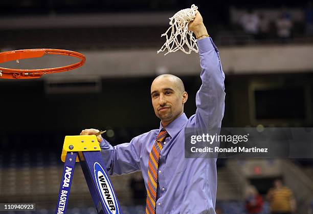 Head coach Shaka Smart of the Virginia Commonwealth Rams cuts the net after defeating the Kansas Jayhawks during the southwest regional final of the...