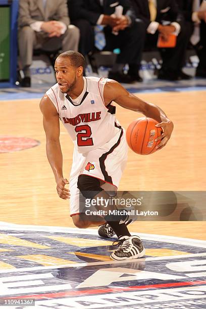 Preston Knowles of the Louisville Cardinals dribbbles the ball during the Quarterfinals of the 2011 Big East Men's Basketball Tournament presented by...