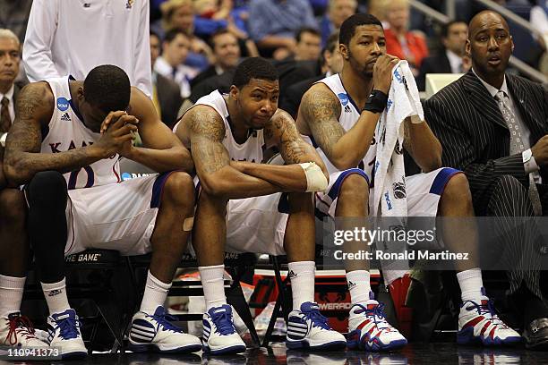 Thomas Robinson, Marcus Morris, Markieff Morris and assistant coach Danny Manning react during the southwest regional final of the 2011 NCAA men's...