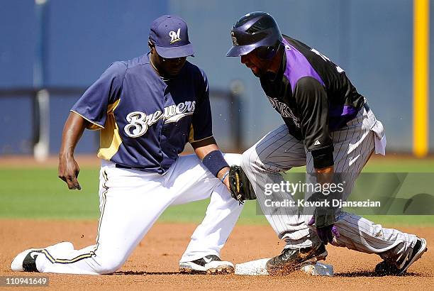 Rickie Weeks of the Milwaukee Brewers gets the out on Willy Taveras of the Colorado Rockies during spring training baseball game at Maryvale Baseball...