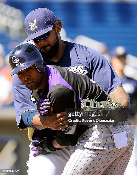 Prince Fielder of the Milwaukee Brewers gets the out on Willy Taveras of the Colorado Rockies during spring training baseball game at Maryvale...