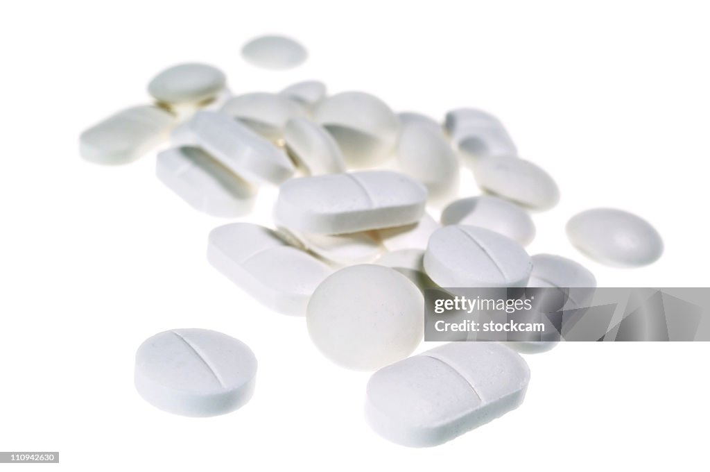 White pile of painkiller pills isolated