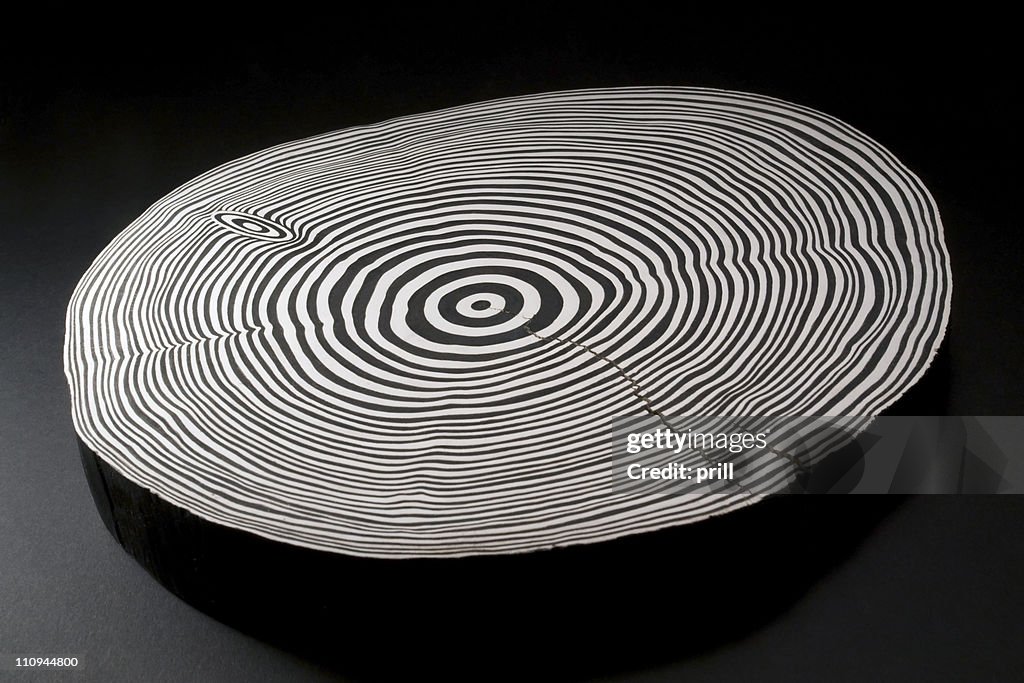 Sliced wood with black and white annual rings