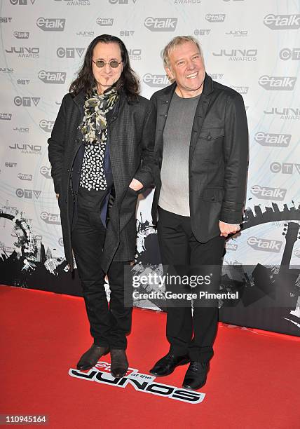 Geddy Lee and Alex Lifeson of Rush pose on the red carpet at the 2011 Juno Awards at the Air Canada Centre on March 27, 2011 in Toronto, Canada.