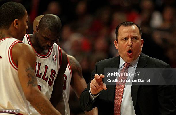 Head coach Tom Thibodeau of the Chicago Bulls gives instructions to Derrick Rose, Loul Deng and Keith Bogans during a game against the Memphis...