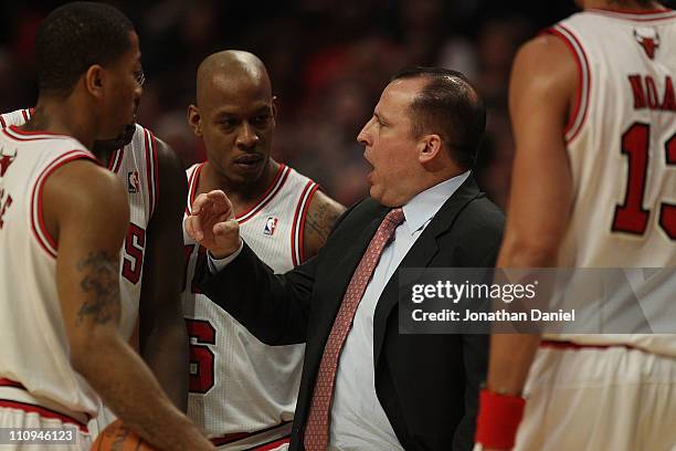 Head coach Tom Thibodeau of the Chicago Bulls gives instructions to Derrick Rose, Loul Deng, Keith Bogans and Joakim Noah during a game against the...