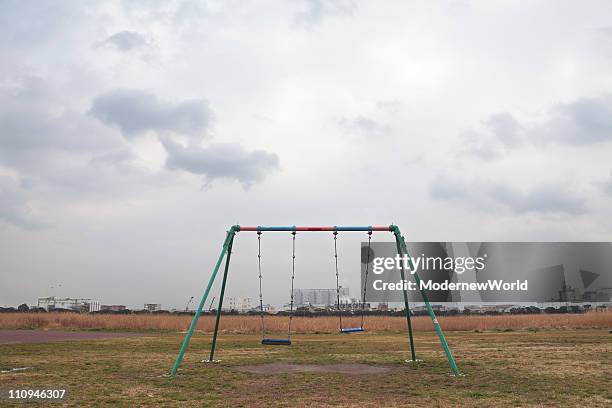 the swing set - abandoned playground stock pictures, royalty-free photos & images