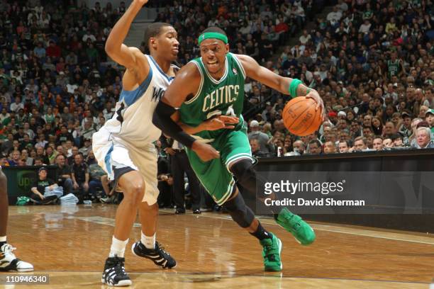 Paul Pierce of the Boston Celtics drives against Wesley Johnson of the Minnesota Timberwolves on March 27, 2011 at Target Center in Minneapolis,...