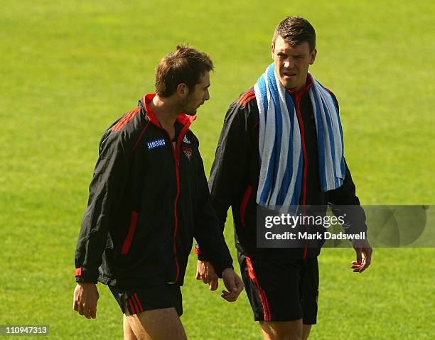 Jobe Watson and David Hille walk laps of the oval before finishing their recover in the pool during an Essendon Bombers AFL training session at Windy...