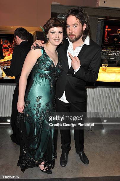 Singers Meaghan Smith and Kevin Drew of Broken Social Scene pose backstage in the eTalk Lounge during the 2011 Juno Awards at the Air Canada Centre...