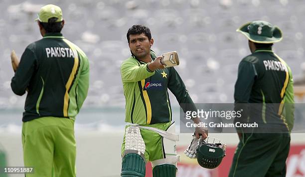 Kamran Akmal gestures during a Pakistan nets session at the Punjab Cricket Association Stadium on March 28, 2011 in Mohali, India. India will play...