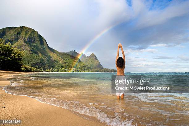 rainbow beach woman hawaii - kauai stock pictures, royalty-free photos & images