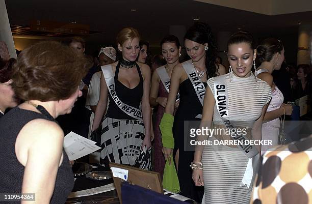 Petra Kocarova , Miss Czech Republic 2001; Juliana Borges , Miss Brazil 2001; and Zuzana Basturova , Miss Slovak Republic 2001, browse the gifts of...