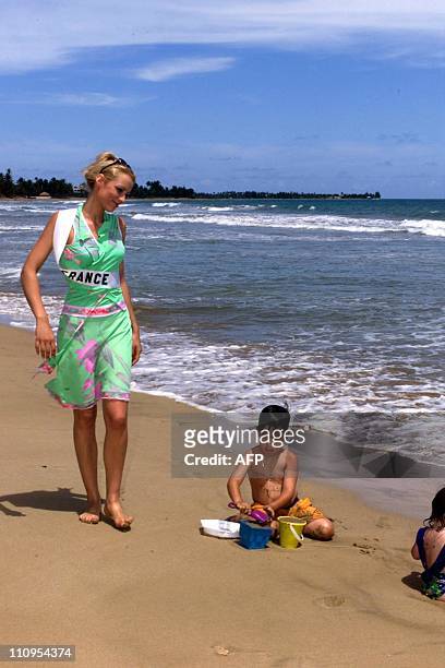 Elodie Gossuin, Miss France 2001, walks in the sand enjoying a few minutes away from all of the media attention from her first week of competition in...