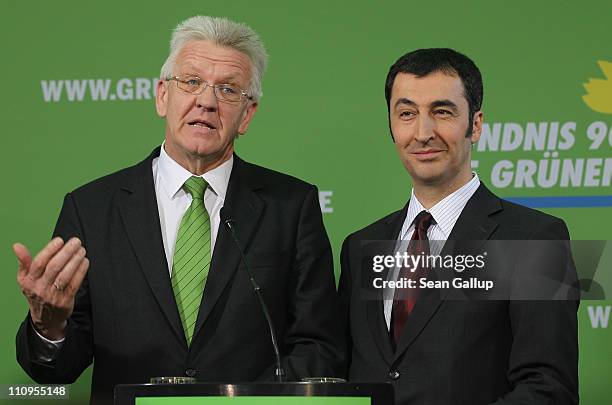 German Greens Party co-chairman Cem Oezdemir and Greens Party candidate in the state of Baden-Wuerttemberg Winfried Kretschmann speak to the media at...