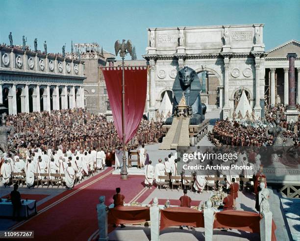 Actress Elizabeth Taylor stars as the titular Egyptian monarch in the 20th Century Fox film 'Cleopatra', 1963. Here she arrives in Rome, amidst great...