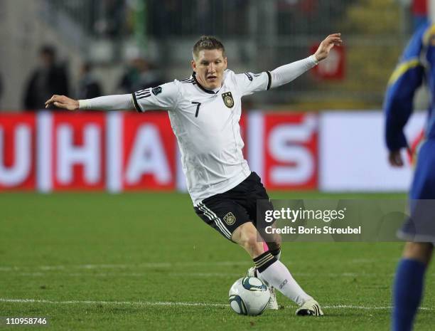 Bastian Schweinsteiger of Germany runs with the ball during the EURO 2012 Group A qualifier match between Germany and Kazakhstan at...