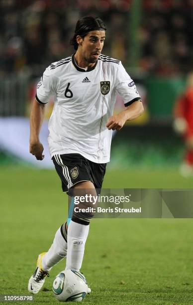 Sami Khedira of Germany runs with the ball during the EURO 2012 Group A qualifier match between Germany and Kazakhstan at Fritz-Walter-Stadium on...