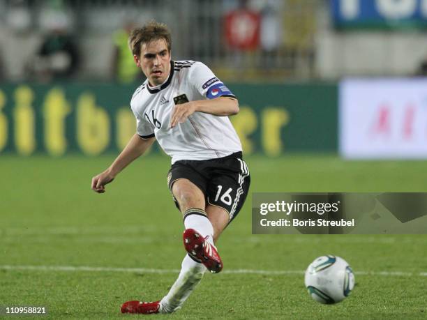 Philipp Lahm of Germany runs with the ball during the EURO 2012 Group A qualifier match between Germany and Kazakhstan at Fritz-Walter-Stadium on...