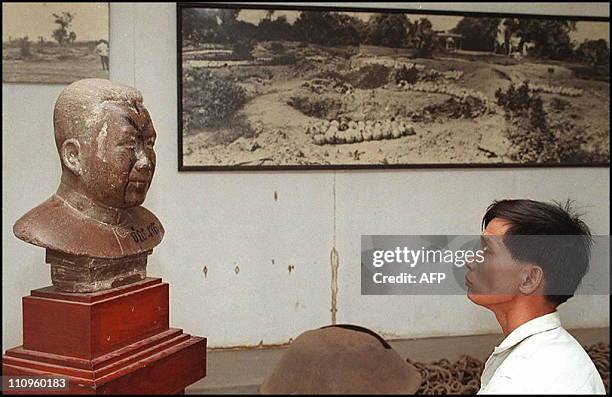 Cambodian man looks at a bust of Pol Pot at the Tuol Sleng genocide museum, a highschool in which the Khmer Rouge turned into prison a and an...