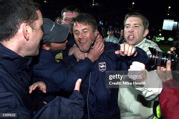 Brighton fans celebrate with their team manager Micky Adams after winning the Third Division Title after the match between Brighton and Hove Albion...