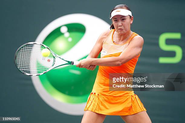 Shuai Peng of China hits a return against Alexandra Dulgheru of Romania of during the Sony Ericsson Open at Crandon Park Tennis Center on March 28,...