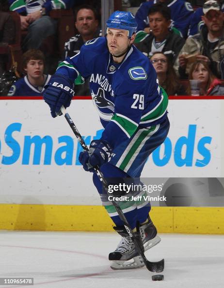 Aaron Rome Aaron Rome of the Vancouver Canucks skates up ice with the puck... News ...