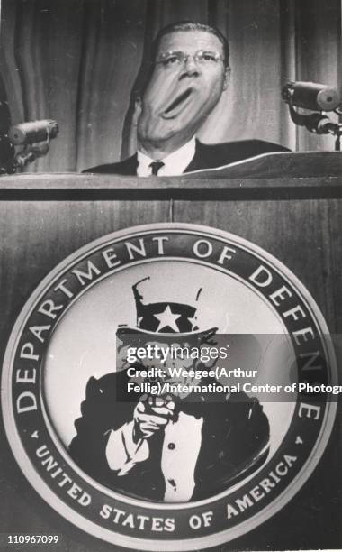 Distorted image of US Secretary of Defense Robert McNamara as he speaks from a lecturn, mid 1960s. In addition to manipulation of McNamaras face,...