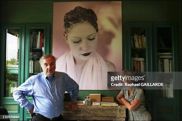 Michel Poitevin and his wife in front of a photograph by Natacha Lesueur in Lille, France on May 01, 2004.