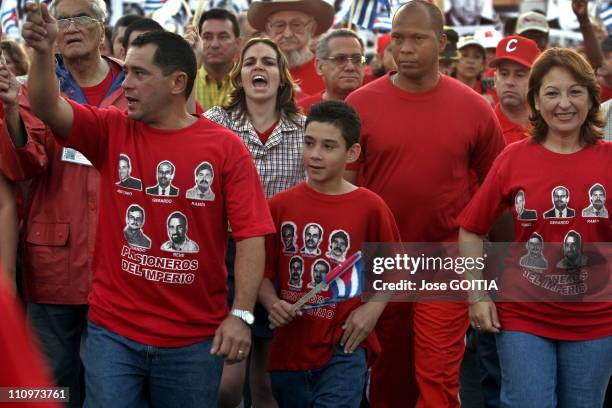 Cuban Boy Elian Gonzales center, his father Juam Miguel Gonzales, left and Yadira Garcia, right, are seen in front of a march on the Malecon Avenue...