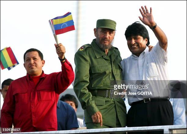 Cuban President Fidel Castro , Bolivian President Evo Morales , and Venezuelan President Hugo Chavez , wave to the crowd during a meeting between the...