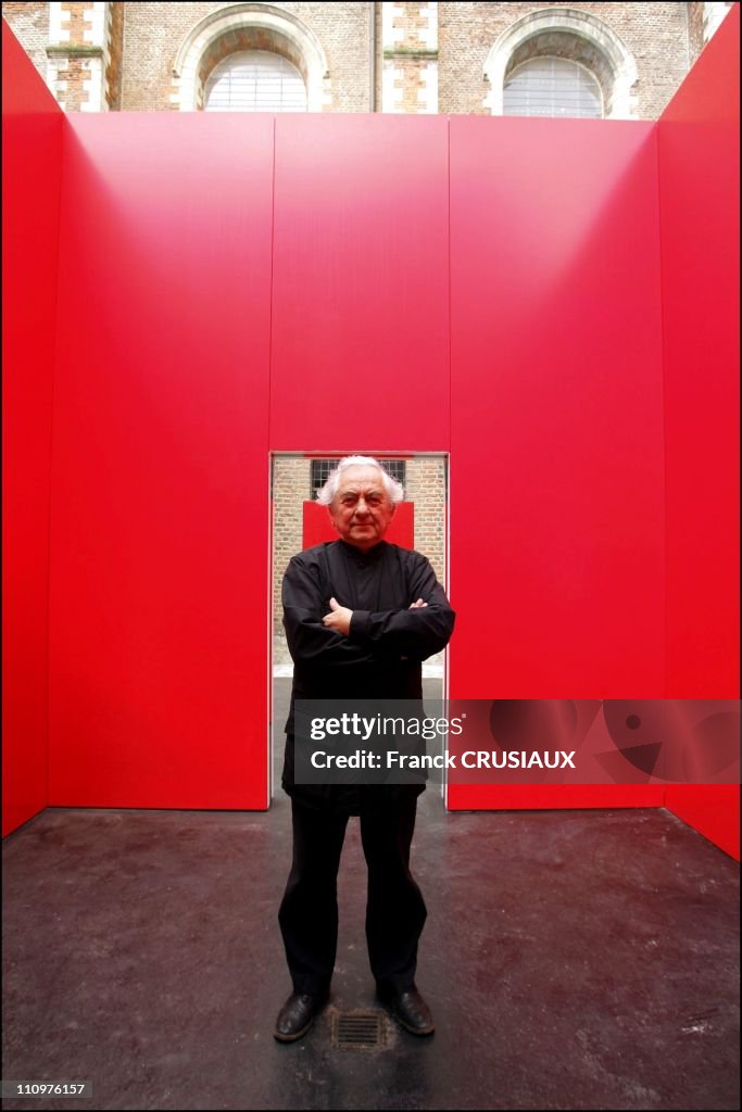 Artist Daniel Buren and his "Cabane rouge aux miroirs " bought in the city of Douai for its Chartreuse Museum in Douai, France on May 31st, 2006.