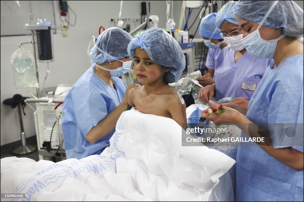 Professor Deloche performs surgical operation on young Ghulam Sultami Masoura at the George Pompidou Hospital in Paris, France in June 2003.