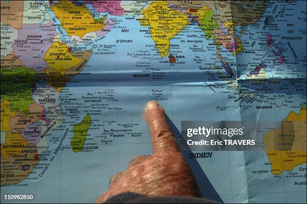 Jacques Moreau's finger showing the place where he washed up with Madeleine, on Chagos Island in France on June 24, 2003.