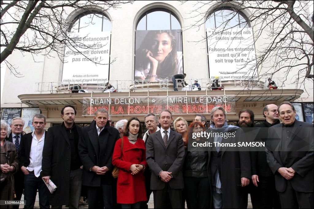 Installation of 3 portraits of Ingrid Betancourt on the facade of the Marigny Theater in Paris, France on February 1st, 2007