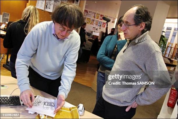 The designer Cabu and Gerard Biard, editor in chief at the time of the choice of the weekly in Paris, France on February 5th, 2007