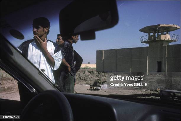 Discovery of a recent mass grave inside the courtyard of the prison - Political prisoners were executed and rapidly buried as American troops...