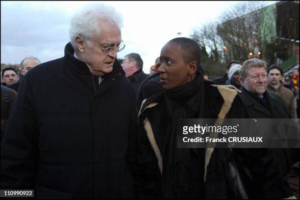 Lionel Jospin with the wife of Marc Vivien Foe in Lens, France on February 28, 2004.