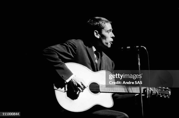 Jacques Brel performs at the Olympia in Paris, France in October , 1964