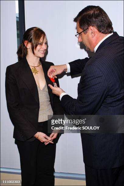 French sports minister Jean Francois Lamour awards the Legion Honour medal to Virginie Dedieu in Paris, France on April 11th, 2007 - Virginie Dedieu