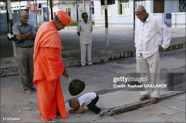 Shravana Belgola, a very young Jain devotee swears allegiance to Sri Charukeerthi Bhattarakha Maharaj in India in November , 2004.