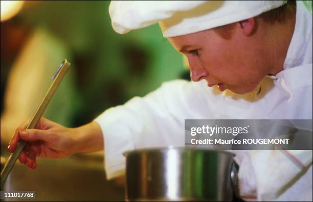 Chef Helene Darroze in action with his cap to the old in Paris, France on January 01st, 2005.