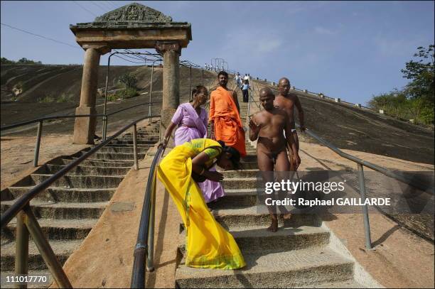 Shravana Belgola, Chandragiri mountain, Digambara monks walking down the stairs after meditation in India in November , 2004.