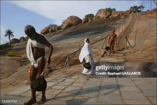 Shravana Belgola, Chandragiri mountain, Digambara monk and nun walking up the stairs leading to the places of meditation in India in November , 2004.