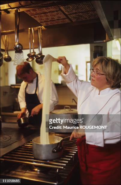 Chef Isabelle Auguy preparing aligot at Grand Hotel Auguy in Laguiole in France on February 01st, 2005.