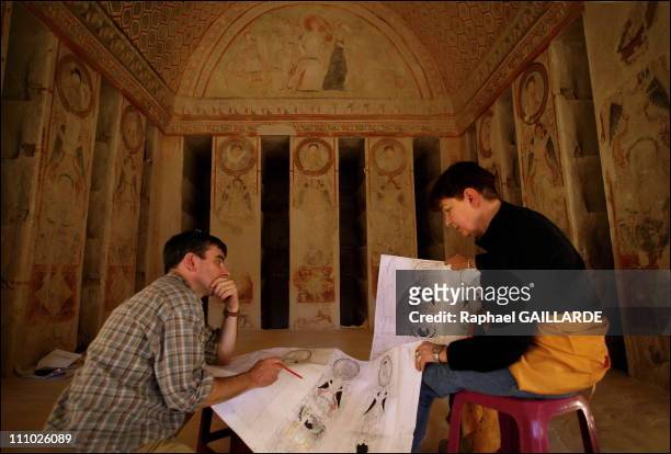Archaeologists Claude-Vibert Guigue and Helene Eristov compare the graphic readings of the Victory Pillars located in the main chamber - Between each...