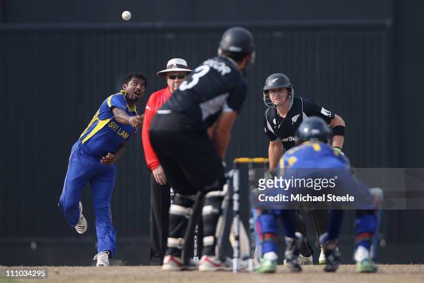Muttiah Muralitharan of Sri Lanka bowls to Ross Taylor during the 2011 ICC World Cup Semi-Final match between New Zealand and Sri Lanka at the R....