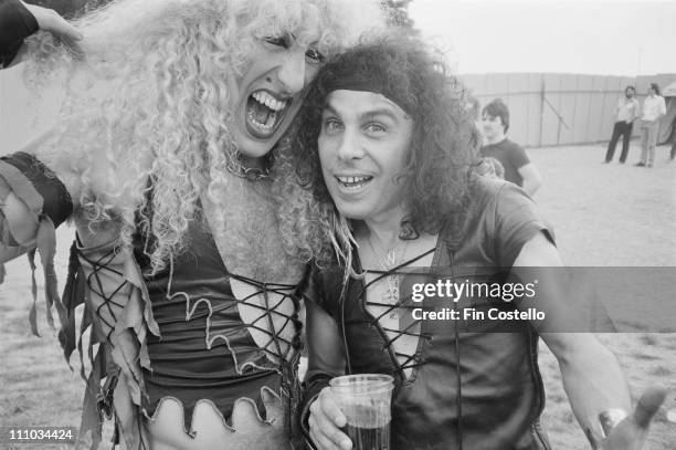 20th AUGUST: Dee Snider from Twisted Sister and Ronnie James Dio from Rainbow, Black Sabbath and Dio posed backstage at the Donnington Festival,...